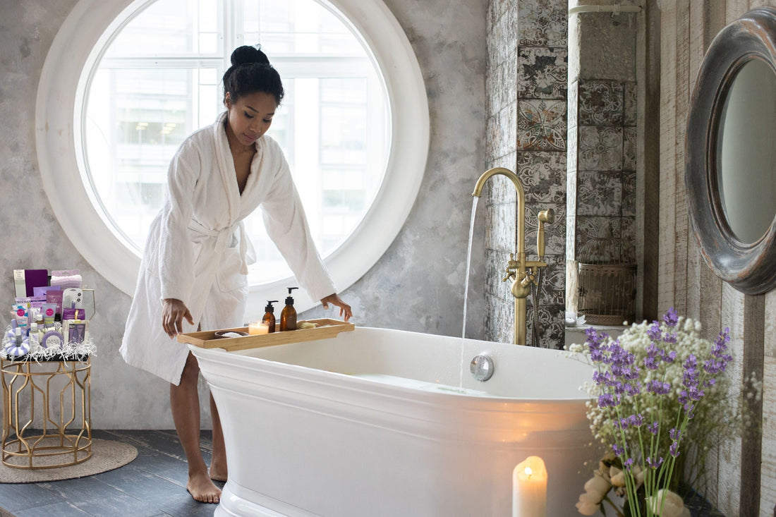 woman using lavender products in at home self care routine for stress relief.
