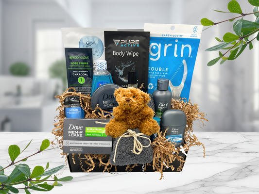 Men’s self-care gift box featuring essentials for grooming and hygiene. Includes deodorant, bar soap, scalp care shampoo, skin moisturizer, antiperspirant, cleansing hand gel, cotton cleansing cloth, floss sticks, face mask, minty mouthwash, cleansing body wipe, bay rum cologne oil, and moisturizing lip balm. Perfect gift for him